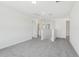 Spacious living room features neutral paint and plush carpet at 312 Castle Dr, Lake Alfred, FL 33850