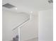 Bright staircase with gray carpeted steps and white walls at 312 Castle Dr, Lake Alfred, FL 33850