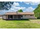 Lawn view of the back of the house on a sunny day at 320 Dublin Dr, Lake Mary, FL 32746