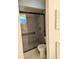 Modern bathroom with a tiled walk-in shower featuring black trim and glass door at 320 Dublin Dr, Lake Mary, FL 32746