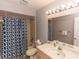 Bathroom featuring a shower, toilet, vanity sink, and mirror at 320 Dublin Dr, Lake Mary, FL 32746