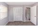 Bedroom with carpet flooring, closet, and a window with blinds at 320 Dublin Dr, Lake Mary, FL 32746