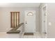 Inviting foyer with a glass paneled door, neutral paint and a coat closet at 320 Dublin Dr, Lake Mary, FL 32746