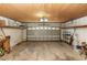 Spacious garage with overhead lighting, storage shelves, and ample room for vehicles at 320 Dublin Dr, Lake Mary, FL 32746