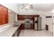 Modern kitchen featuring stainless steel appliances, granite countertops, and wood cabinets at 320 Dublin Dr, Lake Mary, FL 32746