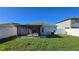 View of backyard with a screened-in patio at 3734 Hampton Hills Dr, Lakeland, FL 33810