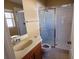 Bathroom featuring a framed glass shower, toilet, and sink at 3734 Hampton Hills Dr, Lakeland, FL 33810