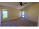 Bedroom featuring a ceiling fan, carpet, and a door to the outdoor at 3734 Hampton Hills Dr, Lakeland, FL 33810