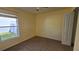 Bedroom featuring a window, carpeted flooring, and a closet at 3734 Hampton Hills Dr, Lakeland, FL 33810