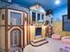 A whimsical playroom with a castle theme and a fun, immersive play area at 411 Muirfield Loop, Reunion, FL 34747