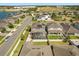 Aerial view of home with lake in background and screened pool in backyard at 432 Treasure Ln, Sanford, FL 32771