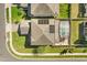 Aerial view of roof with solar panels and screened pool with manicured lawn at 432 Treasure Ln, Sanford, FL 32771