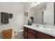 Bathroom with dark wood vanity, white countertop, and shower-tub combo with gray accents at 432 Treasure Ln, Sanford, FL 32771