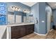 Bathroom featuring a double sink vanity with granite countertop and decorative stained glass window at 432 Treasure Ln, Sanford, FL 32771