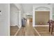 Bright hallway with wood-look tile floors leading to the kitchen and other living areas at 4907 Culdesac Ct, St Cloud, FL 34772