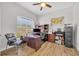 Home office with a vaulted ceiling, large window, and wood-look tile flooring at 4907 Culdesac Ct, St Cloud, FL 34772