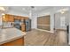 View of kitchen showcasing stainless appliances, wood cabinets, and bright flooring at 4907 Culdesac Ct, St Cloud, FL 34772