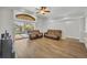 View of open-concept living room leading out to a screened pool at 4907 Culdesac Ct, St Cloud, FL 34772