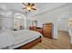 Main bedroom featuring wood-look flooring, ceiling fan, and lots of closet space at 4907 Culdesac Ct, St Cloud, FL 34772