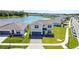 Aerial view of a charming two-story home near a lake and neighborhood at 5074 Sparkling Water Way, Kissimmee, FL 34746