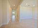 Bright hallway features tile flooring, recessed lighting, and a view of the home interior at 5074 Sparkling Water Way, Kissimmee, FL 34746