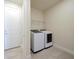 Laundry room featuring side-by-side washer and dryer, and tiled floors at 5074 Sparkling Water Way, Kissimmee, FL 34746