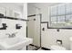 Black-and-white tiled bathroom featuring a standing shower, new toilet, and vanity at 520 Oriole Dr, Lakeland, FL 33803