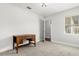 Bright, freshly painted bedroom with plush carpet, featuring a vintage writing desk at 520 Oriole Dr, Lakeland, FL 33803