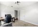 Bright bedroom featuring two windows, a comfortable sofa, a modern desk, and an ergonomic chair at 520 Oriole Dr, Lakeland, FL 33803