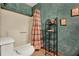 Bathroom featuring a tub/shower combo, and faux-painted wall at 5429 Lake Margaret Dr # 185, Orlando, FL 32812