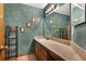 Stylish bathroom showcasing a faux-painted wall, vanity, and decorative shelving at 5429 Lake Margaret Dr # 185, Orlando, FL 32812