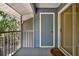 View of the screened patio with door to a storage area at 5429 Lake Margaret Dr # 185, Orlando, FL 32812