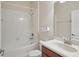 Bright bathroom features a shower and bathtub combination with a single sink vanity at 5832 Tarleton Way, Mount Dora, FL 32757