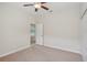 Bedroom featuring a ceiling fan and doorway to a smaller room at 5832 Tarleton Way, Mount Dora, FL 32757