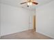 A cozy bedroom with a ceiling fan and neutral tones provides a peaceful retreat at 5832 Tarleton Way, Mount Dora, FL 32757