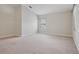 Bright, carpeted bedroom with a large window allowing plenty of natural light to fill the space at 5832 Tarleton Way, Mount Dora, FL 32757