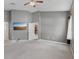Bedroom with gray walls, a ceiling fan, and a doorway leading to the hallway at 5832 Tarleton Way, Mount Dora, FL 32757