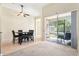 Bright dining area with a ceiling fan and sliding glass doors leading to an outdoor patio at 5832 Tarleton Way, Mount Dora, FL 32757