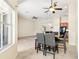 Open dining area with tile flooring, modern ceiling fan, and access to kitchen at 5832 Tarleton Way, Mount Dora, FL 32757