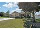 Well-maintained home featuring lush landscaping and a spacious driveway with ample parking at 5832 Tarleton Way, Mount Dora, FL 32757