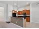 Eat-in kitchen featuring granite countertops, ample cabinet space, and black appliances at 5832 Tarleton Way, Mount Dora, FL 32757