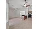 Open living space with ceiling fans, and seamlessly connects to the modern kitchen area at 5832 Tarleton Way, Mount Dora, FL 32757