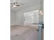 Open living room with breakfast bar and view of the foyer and front door at 5832 Tarleton Way, Mount Dora, FL 32757