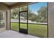 Relaxing screened patio offers a peaceful view of the lush, green backyard at 5832 Tarleton Way, Mount Dora, FL 32757
