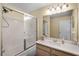 Bathroom featuring a shower with sliding glass doors, vanity and neutral color palette at 631 Reserve Dr, Davenport, FL 33896