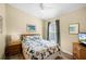 Bedroom featuring a bed, hardwood floors, a window with blinds and stylish wall art at 631 Reserve Dr, Davenport, FL 33896