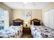 Bedroom featuring two twin beds, hardwood floors, a window with blinds and stylish wall art at 631 Reserve Dr, Davenport, FL 33896