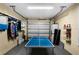 Garage with ping pong table, a garage door, laundry machines and colorful accessories for fun at 631 Reserve Dr, Davenport, FL 33896