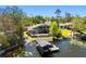Aerial view of the property showcasing the home's lakefront location and private boat dock at 7841 Georgeann St, Winter Park, FL 32792