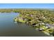 An aerial view of a community of homes on the lake at 7841 Georgeann St, Winter Park, FL 32792